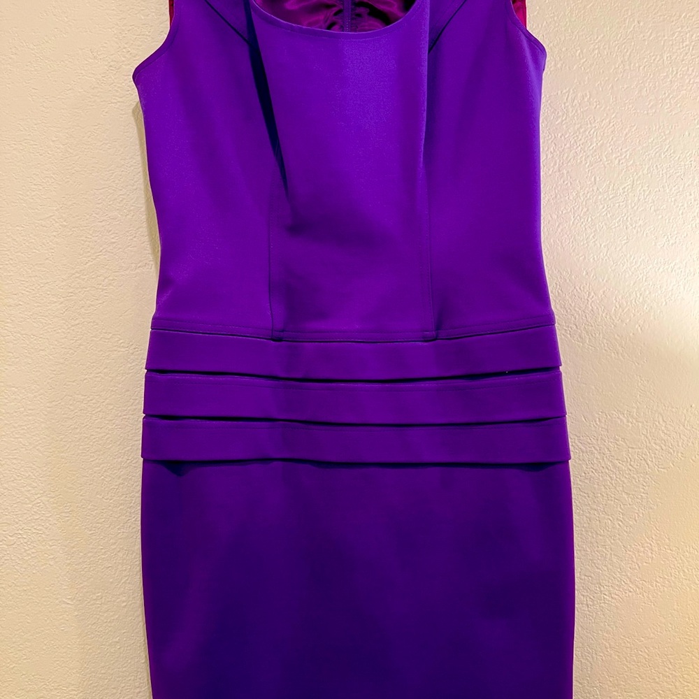 Fitted slendering purple mini dress.